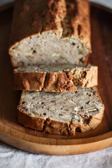 Close-up of delicious homemade banana bread slices on a wooden plate, perfect for breakfast.